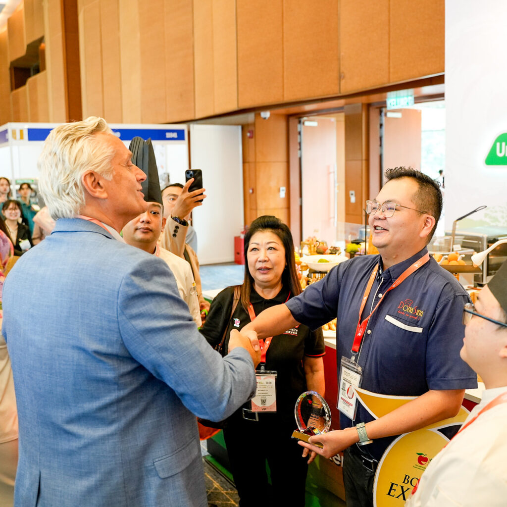 receiving the Booth Design Excellence Award